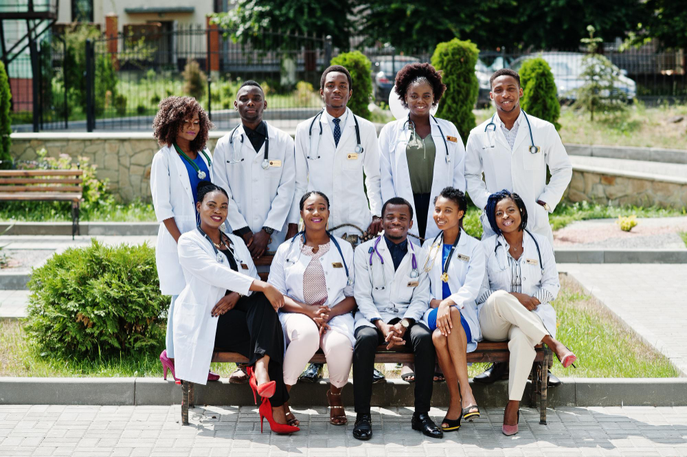 [Replace] Graduate in healthcare uniform smiling
