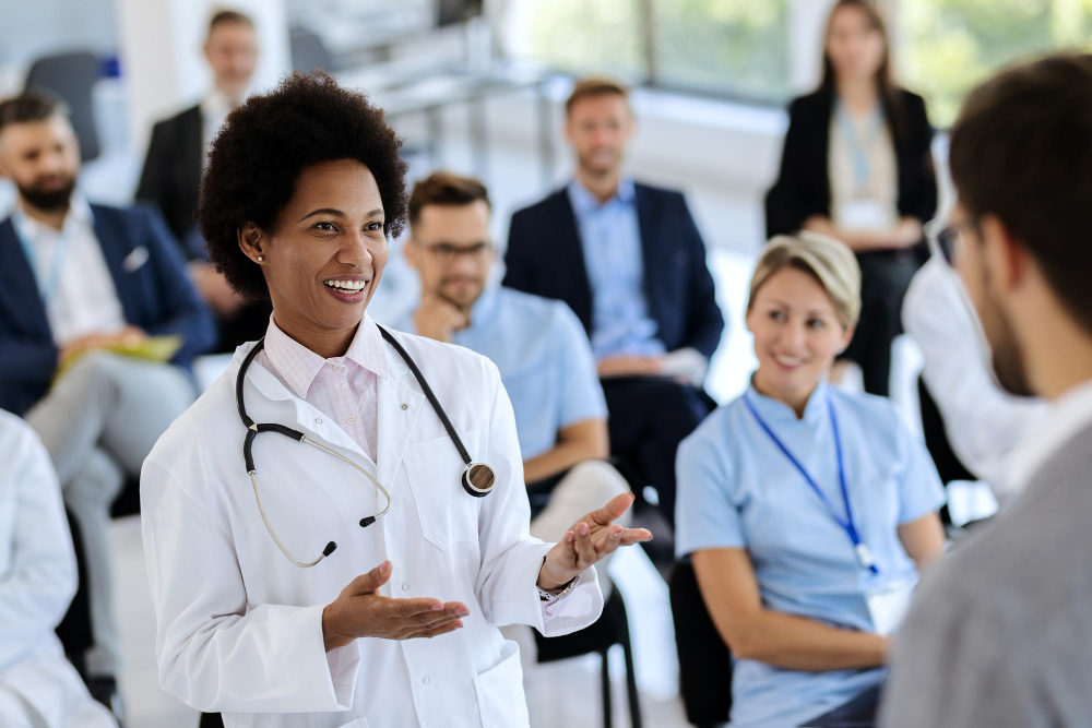 [Replace] Healthcare Leadership — supervisor leading a team huddle